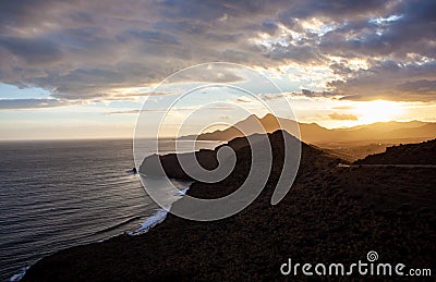 Coastal landscape in golden sunset in Cabo de Gata National Park Almeria Spain Stock Photo