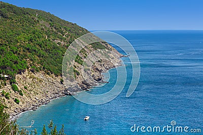 Coastline with cliff mountain and seashore view. Pitched rock face on the sea. Elba island in Italy. Aerial view with rocks and Stock Photo