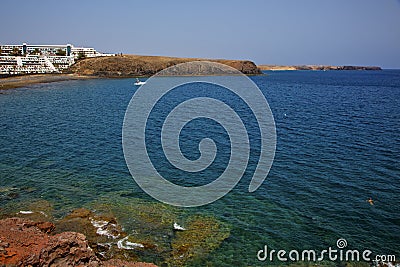 Coastline lanzarote in spain musk pond beach water yacht boat Stock Photo