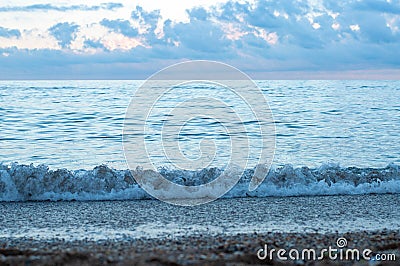 Coastline of sea surf in blue dusk evening Stock Photo