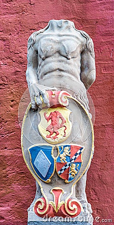Coat of arms with a headless troll at the entrance to Holsteinborg Castle Editorial Stock Photo