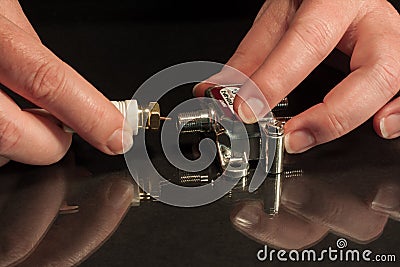 Coax cable connection to coax splitter by hands Stock Photo