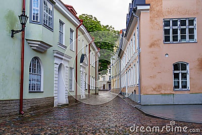 Cobbled alley with puddles after raining in Tallinn Stock Photo