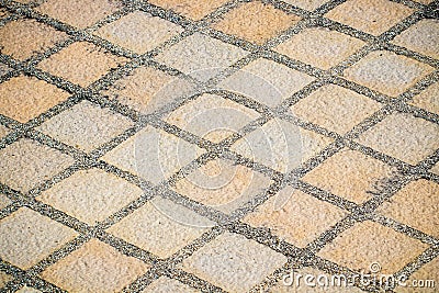Cobbled floor.Detail of a cobbled road.cobblestone pavement or stone pavement texture, abstract background Stock Photo
