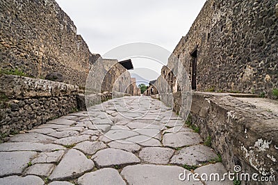 Cobbled street in excavated town of Pompeii, Italy Stock Photo