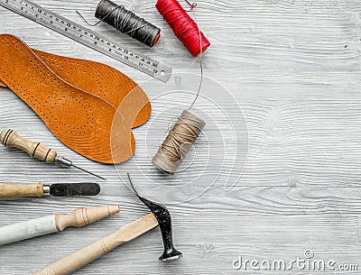 Cobbler takes order. Notebok on grey wooden desk background top view mockup Stock Photo