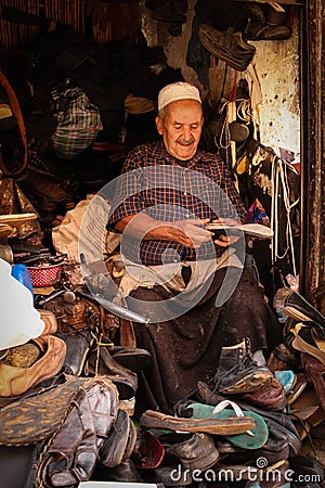 Cobbler at work. Marrakesh. Morocco Editorial Stock Photo