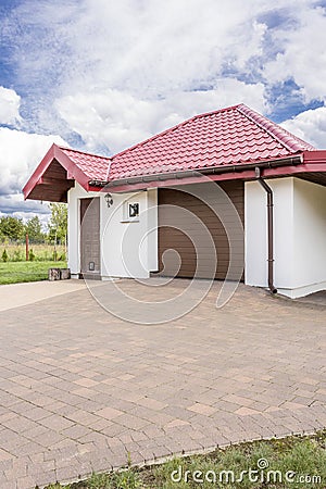 Cobblestone driveway to a beautiful house idea Stock Photo