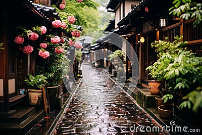 a cobblestone street lined with pink flowers in japan Stock Photo
