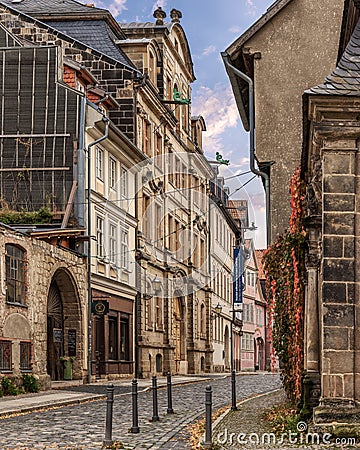 Cobblestone street in Quedlinburg lined with historical buildings Editorial Stock Photo