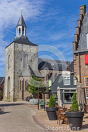 Cobblestoned street leading to the Pancratius church in Tubbergen Editorial Stock Photo