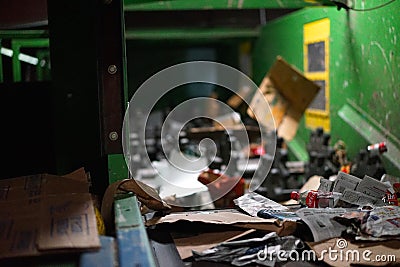 Coca cola bottle nears steel shredder Editorial Stock Photo