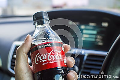 Coke zero no sugar in a driver hand,Coca cola brand Editorial Stock Photo