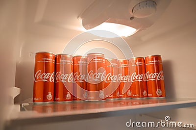 Coca-cola red soda drink cans inside domestic cooler fridge Editorial Stock Photo