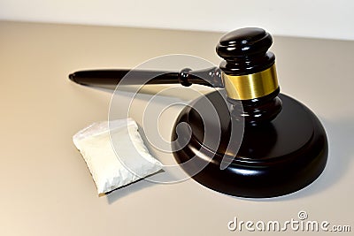 Cocaine and Judge hammer in courtroom. Legal excuse and Justice concept. Sentence to a criminal for committing a drug offense. Stock Photo