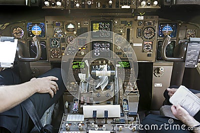 Cockpit and pilots getting ready to start flying Stock Photo