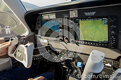 Cockpit of small, sport aircraft. A view of a glass cockpit dashboard and knap Editorial Stock Photo