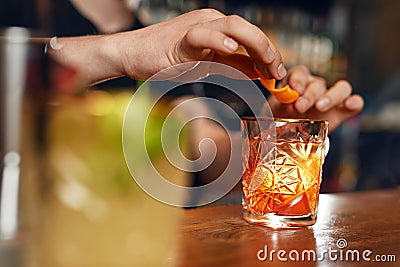 Cocktail. Bartender Preparing Cocktail In Bar Stock Photo