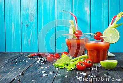 Cocktail Bloody Mary with ice in glasses on a wooden table Stock Photo