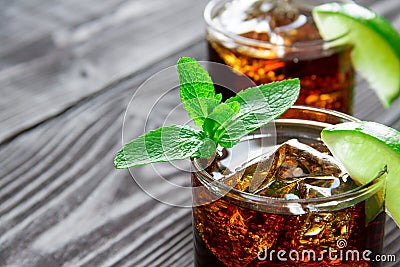 Cocktail with cola, lime and mint Stock Photo