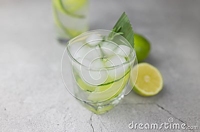 Cocktail drink alcoholic with green cucumber and tonic with lime Stock Photo