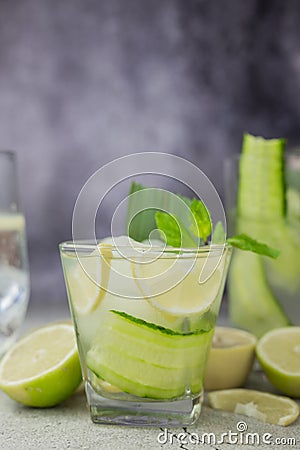 Cocktail drink alcoholic with green cucumber and tonic with lime Stock Photo