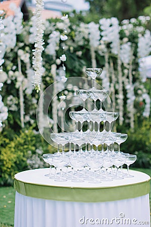 Cocktail glass pyramid on the table for wedding ceremony or reception. Stock Photo