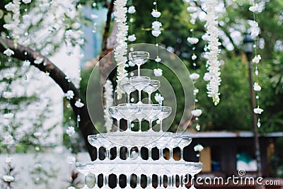 Cocktail glass pyramid on the table for wedding ceremony or reception. Stock Photo