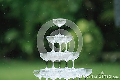Cocktail glass pyramid on the table for wedding ceremony or reception. Stock Photo