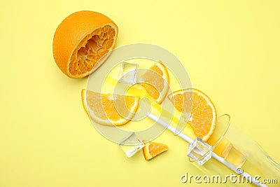 Cocktail illustration with orange, ice cubes and glass on yellow background, flat lay Cartoon Illustration