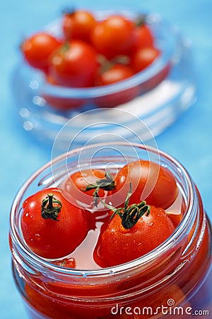 Cocktail tomatoes in jar Stock Photo