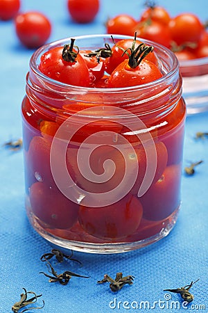 Cocktail tomatoes in jar Stock Photo