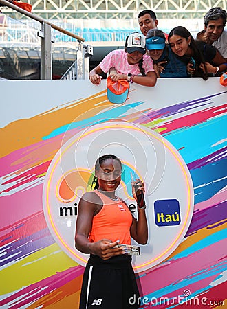 Coco Gauff of USA takes selfie with tennis fans after winning the women's doubles final match at 2023 Miami Open Editorial Stock Photo