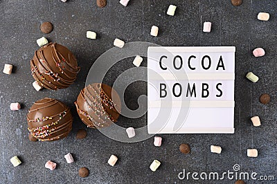 Cocoa bombs with marshmallows, chocolate that melts when hot milk is added for creating a trendy tasty drink. Food Stock Photo