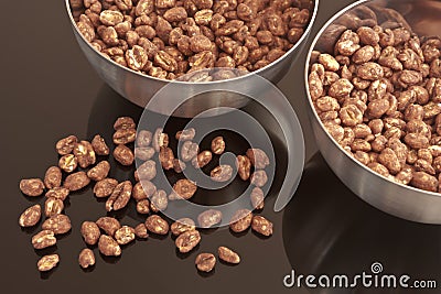 Cocoa coated puffed rice in metal bowls Stock Photo