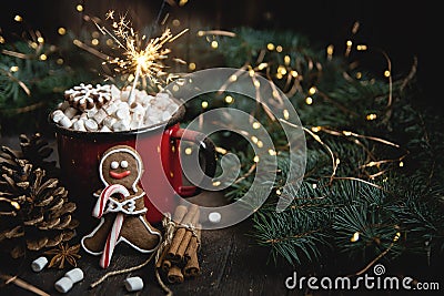 cocoa or hot chocolate with marshmallow on rustic table. Christmas or New Year composition. Gingerbread man with candy cane Stock Photo