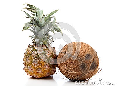 Cocoanut and pineapple on white Stock Photo