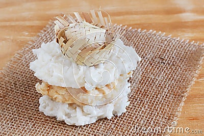 Coconut candy cocada with wicker hat on sackcloth Stock Photo