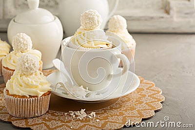 Coconut cupcakes with white frosting Stock Photo