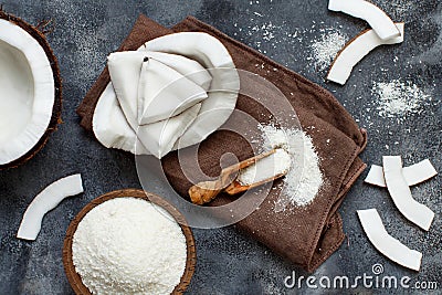 Coconut flour in a wooden spoon top view Stock Photo