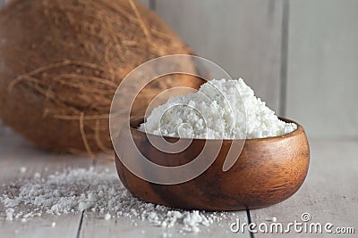 Coconut milk powder in wooden bowl Stock Photo