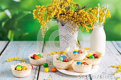 Coconut nests filled with Easter eggs Stock Photo