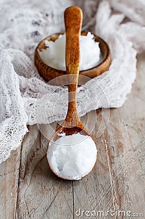 Coconut oil in a bowl with a spoon Stock Photo