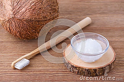 Coconut oil toothpaste, natural alternative for healthy teeth, wooden toothbrush Stock Photo