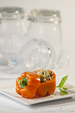 Coconut rice stuffed bell peppers with basil pesto Stock Photo