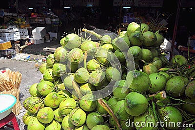 Coconuts for sale to travellers on a treet vendor in Vietnam Editorial Stock Photo