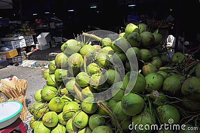 Coconuts for sale to travellers on a treet vendor in Vietnam Editorial Stock Photo