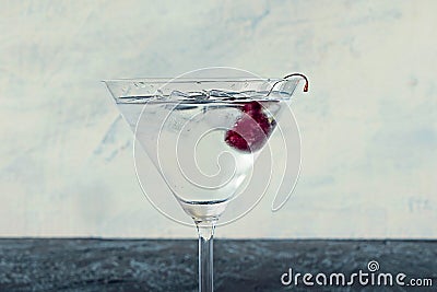 coctail with cherry, ice on black and white background. Summer cold drink and cocktail in minimalist style. Stock Photo