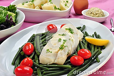 Cod loins with beans and tomato Stock Photo