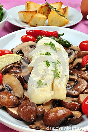 Cod loins with mushroom on a plate Stock Photo